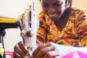An image of a Ugandan woman sewing